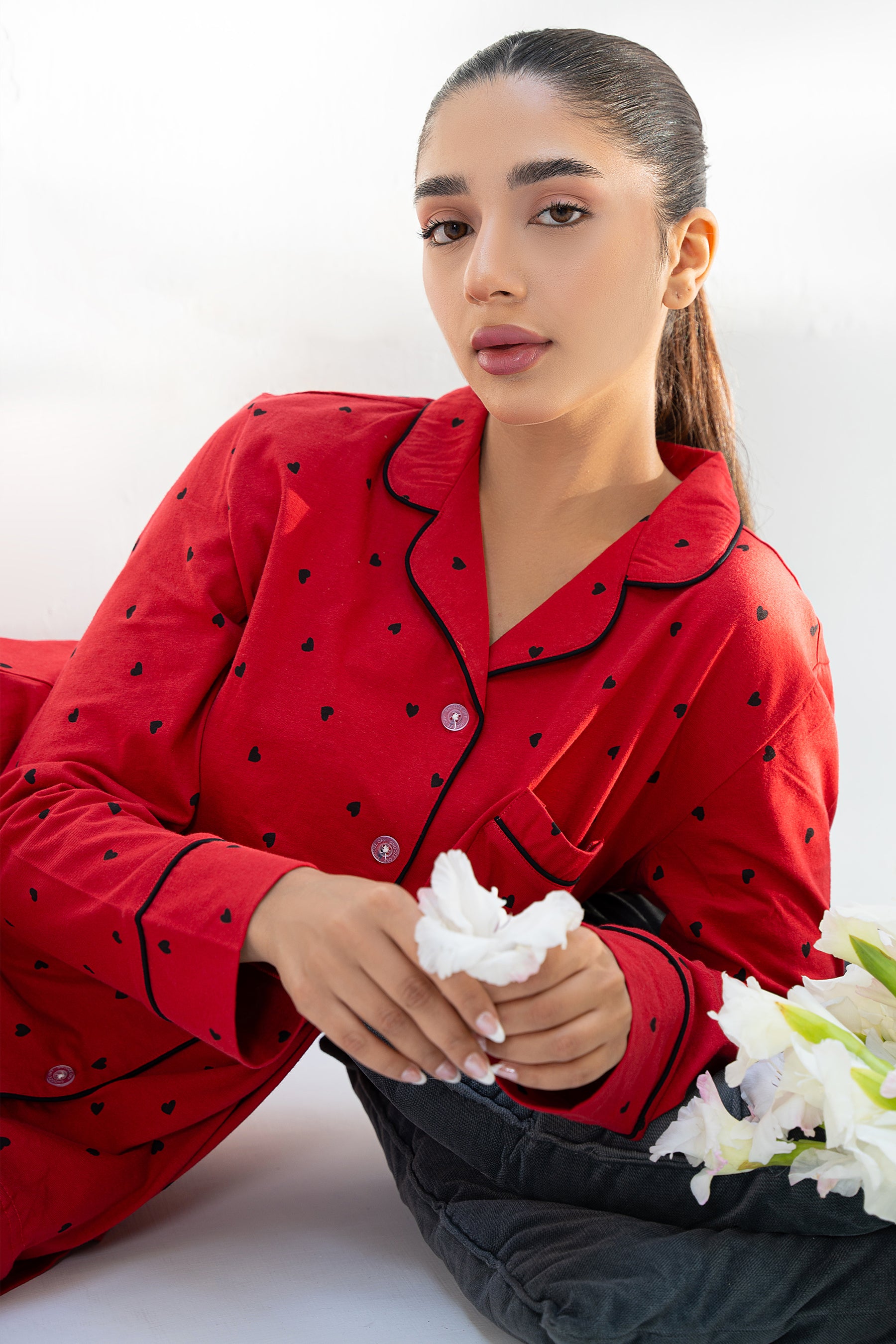 The Heartbeat Women's Button Down PJ Set offers a relaxed fit and soft material for everyday wear.