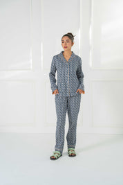 Relax in the Blossom in Blue Cozy Button Down Shirt for Women, paired with soft pajama bottoms.