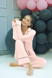 The Blush Soft Fabric Button Down Pajamas provide a luxurious feel with an elegant and timeless design.