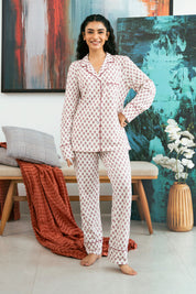 Relax in style with the Coral Blush Button Down Pajamas for Women, designed for all-night comfort and elegance.