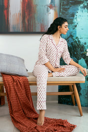 The Coral Blush Soft Fabric Button Down Pajamas bring a stylish yet comfortable touch to your sleepwear collection.