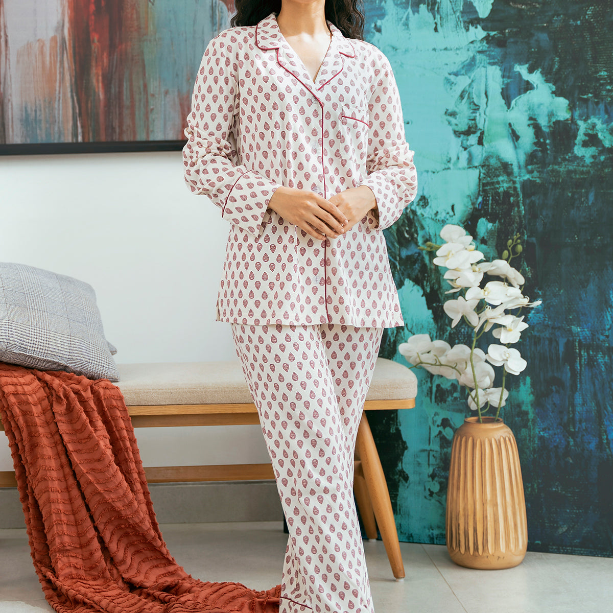 The Coral Blush Women's Button Down Pajama Set offers a soft and breathable feel, perfect for a cozy night’s sleep.