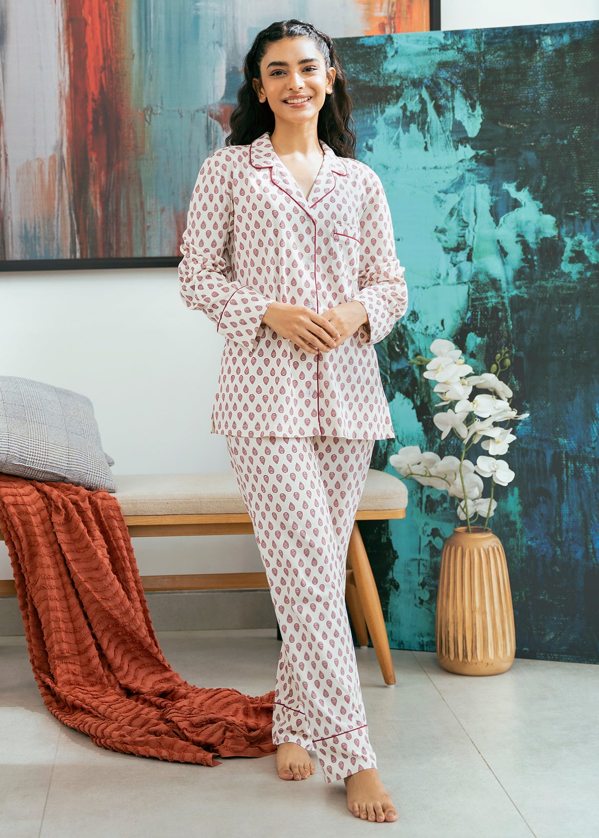 The Coral Blush Women's Button Down Pajama Set offers a soft and breathable feel, perfect for a cozy night’s sleep.