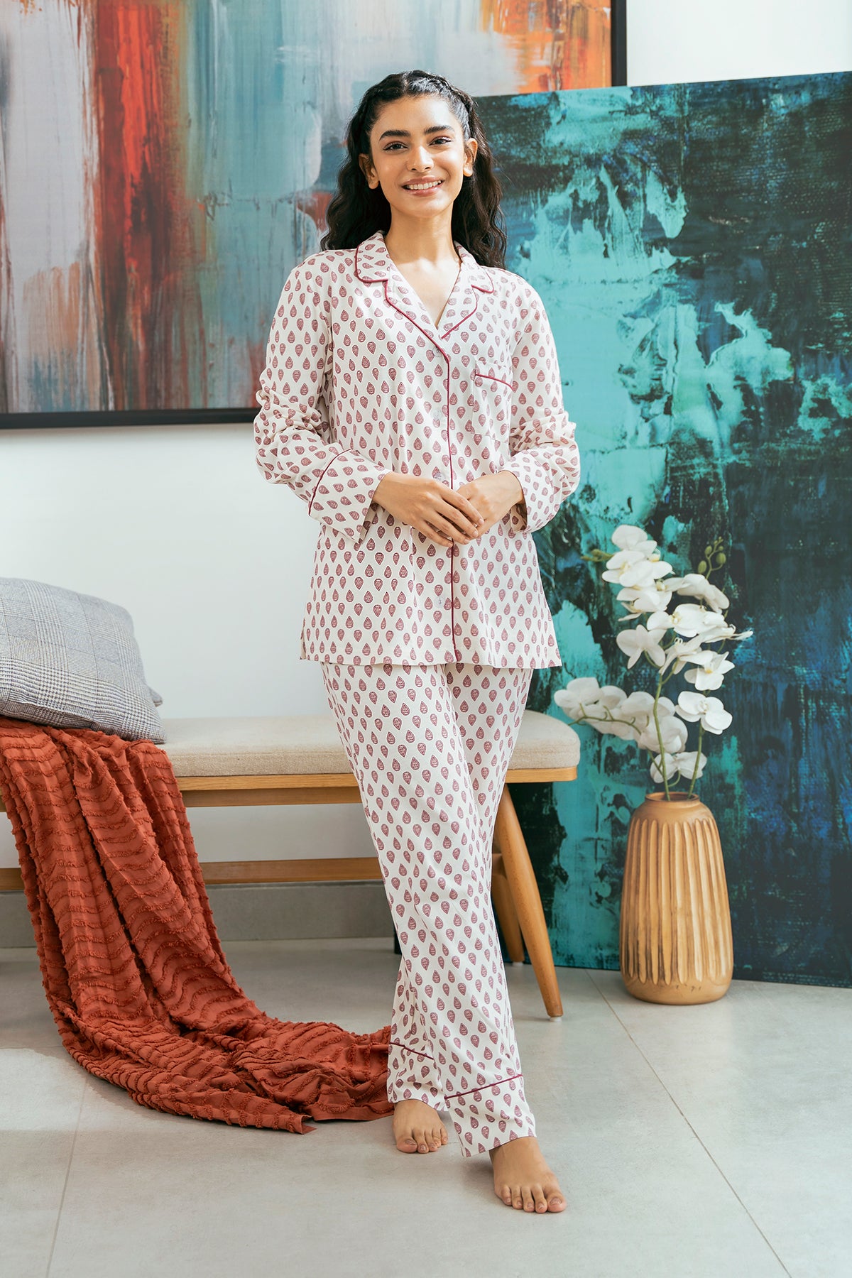 The Coral Blush Women's Button Down Pajama Set offers a soft and breathable feel, perfect for a cozy night’s sleep.