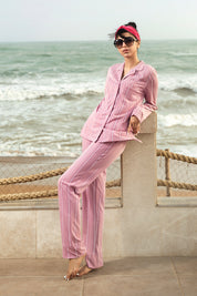 Relax in the Coral Pink Button Down Pajamas for Women, designed with a cozy fit and stylish look for bedtime.