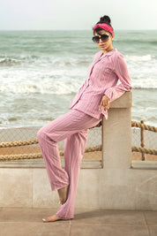 The Coral Pink Lightweight Women's Button Down PJ Set provides a breezy and comfortable option for lounging or sleeping.