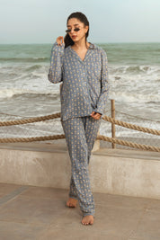 The Country Air Women's Button Down Shirt Pajama Set combines a stylish button-up top with comfortable pants for effortless relaxation.