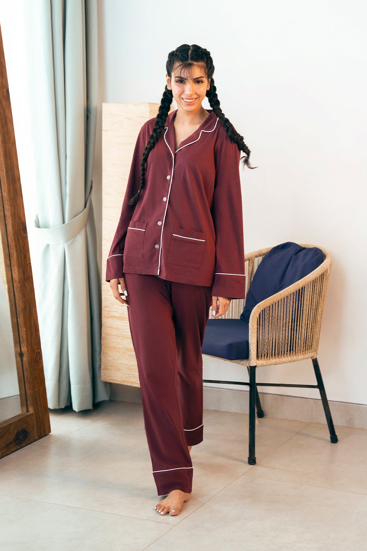 The Crimson Koi Women's Button Down PJ Set features a classic button-up top with comfy pajama bottoms.