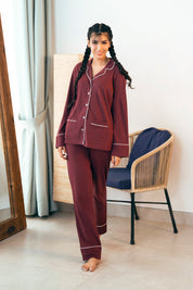 The Crimson Koi Women's Button Down PJ Set features a classic button-up top with comfy pajama bottoms.