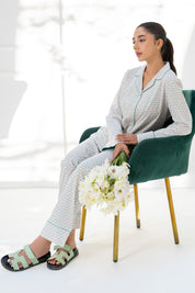 Relax in the Elegant Geometry Cozy Button Down Shirt for Women, paired with matching pajama bottoms.