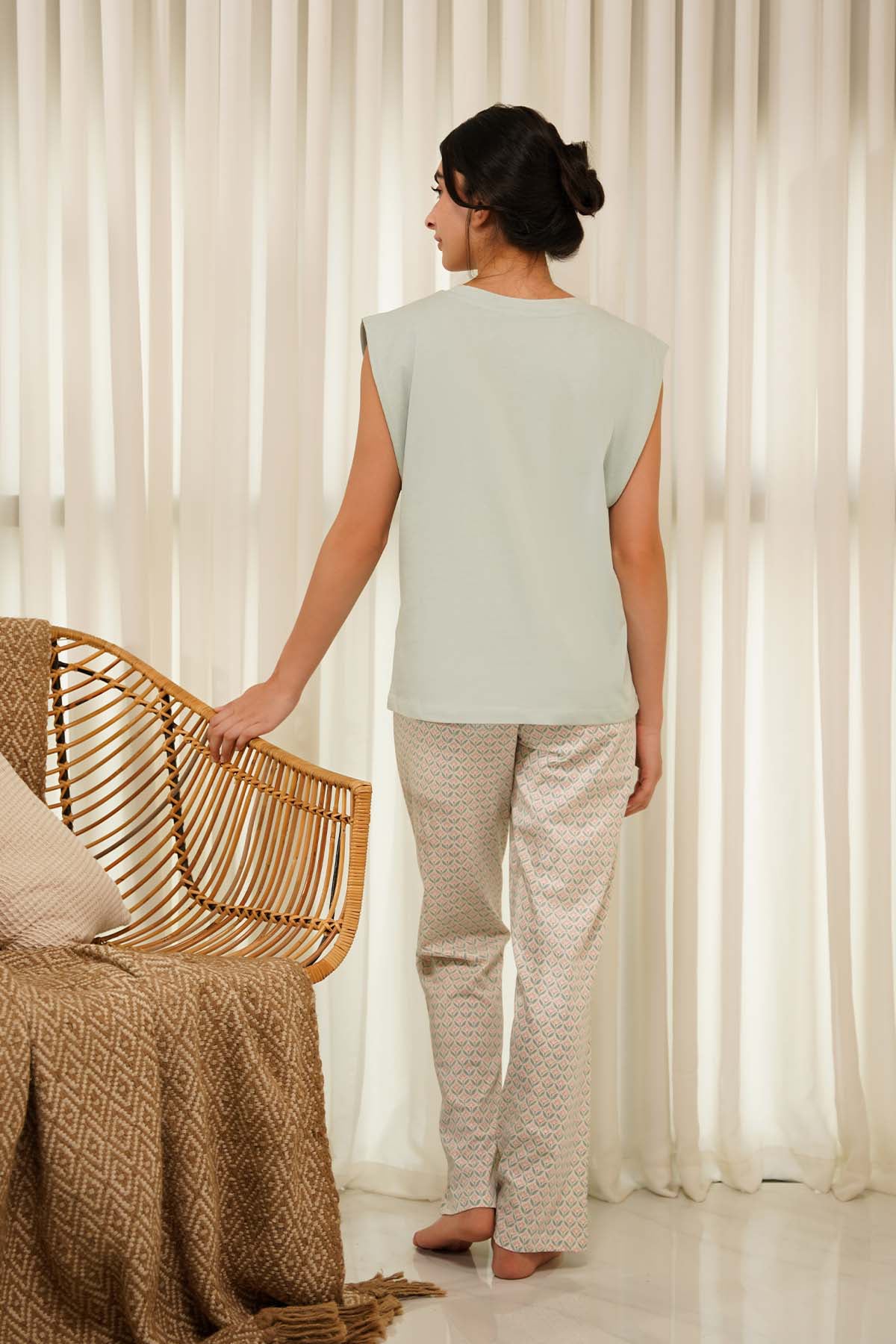 The Eva Ladies Pajamas Set combines style and comfort with a relaxed fit for lounging or sleeping.