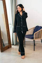 The Midnight Star Women's Button Down Pajama Set offers soft fabric and a relaxed fit for cozy nights.