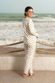 The Moonlight Jade Ladies Pajamas Set features a relaxed fit and soft texture, perfect for lounging or sleeping.