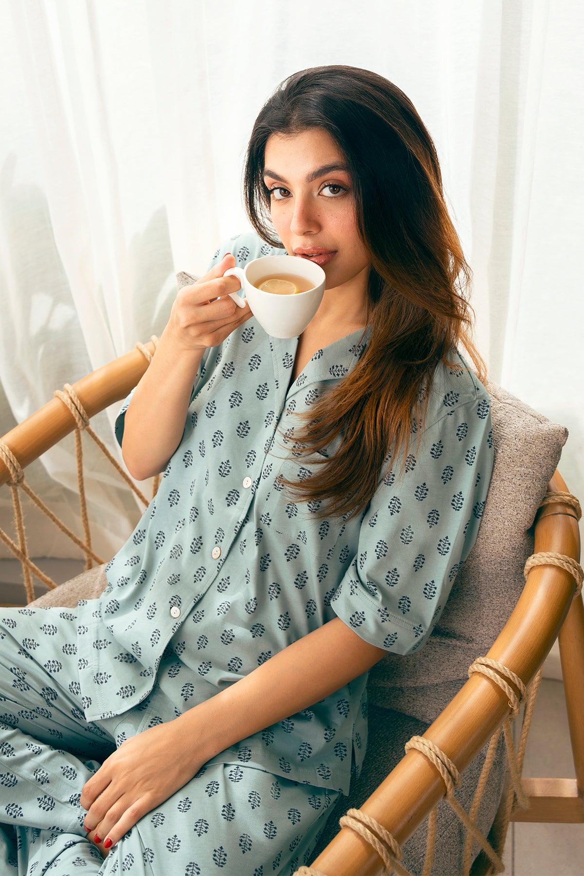 The Palm Oasis Lightweight Button Down Pajamas offer a breathable, stylish, and comfortable fit for any season.
