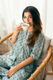 The Palm Oasis Lightweight Button Down Pajamas offer a breathable, stylish, and comfortable fit for any season.