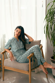 The Palm Oasis Stylish Women's Button Down PJ Set is perfect for lounging or sleeping in ultimate relaxation.