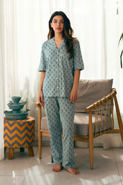 The Palm Oasis Women's Button Down Pajama Set offers a relaxed fit with soft fabric for a cozy night's sleep.