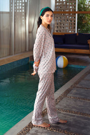 Enjoy cozy comfort with the Serene Shore Button Down Pajamas for Women, designed for both relaxation and style.