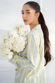 Relax in the Tranquil Harmony Cozy Button Down Shirt for Women, paired with soft pajama bottoms.