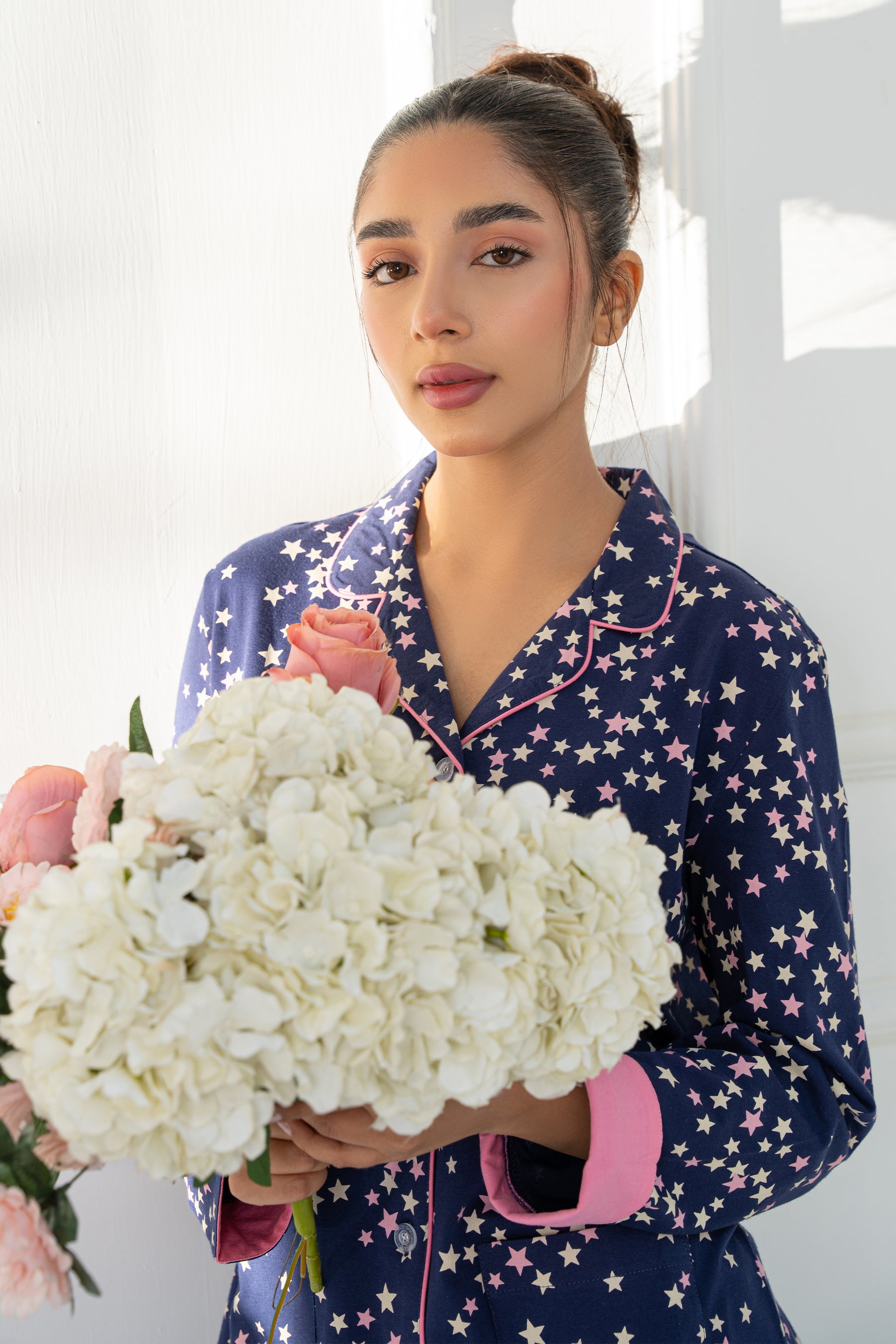 Stay stylish and comfortable in the Under the Stars Navy Cozy Button Down Shirt for Women.