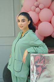 The Whispering Green Women's Button Down Shirt Pajama Set is a blend of elegance and everyday ease.