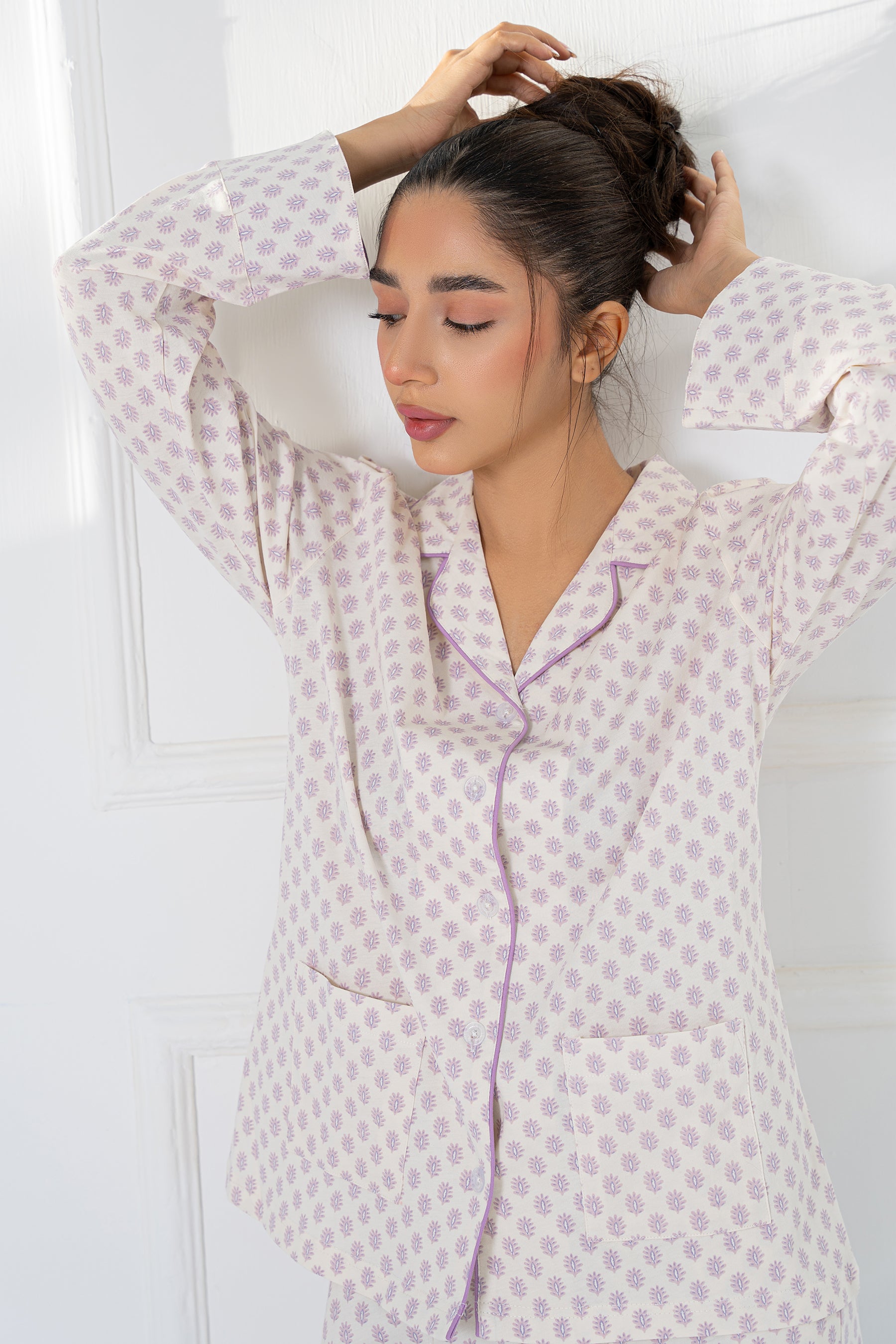 Cozy and stylish Whispering Lilacs Button Down Pajamas for Women, perfect for lounging or bedtime.