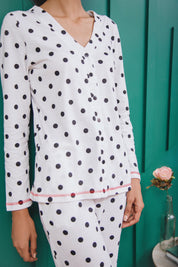 Stay comfortable in the White Dotted Button Down Pajamas for Women, designed for a relaxed fit.
