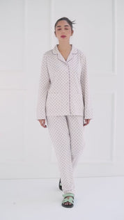 The Whispering Lilacs Elegant Women's Button Down Pajama Set combines style and softness beautifully.